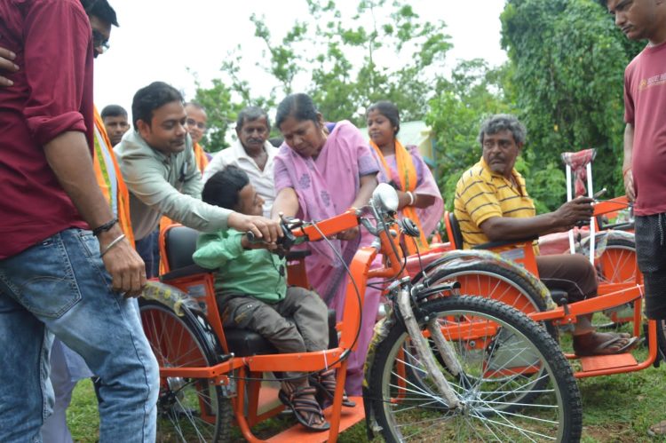 Provision of free motorized tri-cycles to 94 Divyangs