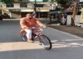 Ratan Lal Nath Cycles to Work Amid Austerity Drive