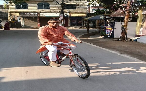Ratan Lal Nath Cycles to Work Amid Austerity Drive